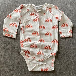 Kate Quinn organic bodysuit